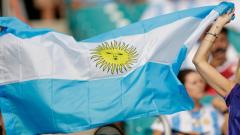 Argentina football fans wave a flag